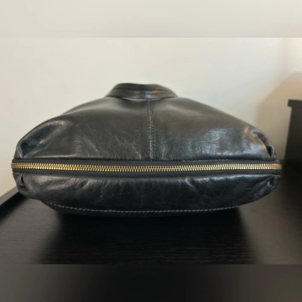 The Sak Expandable Black Leather Suede Shoulder Tote Bag with Suede Tassels